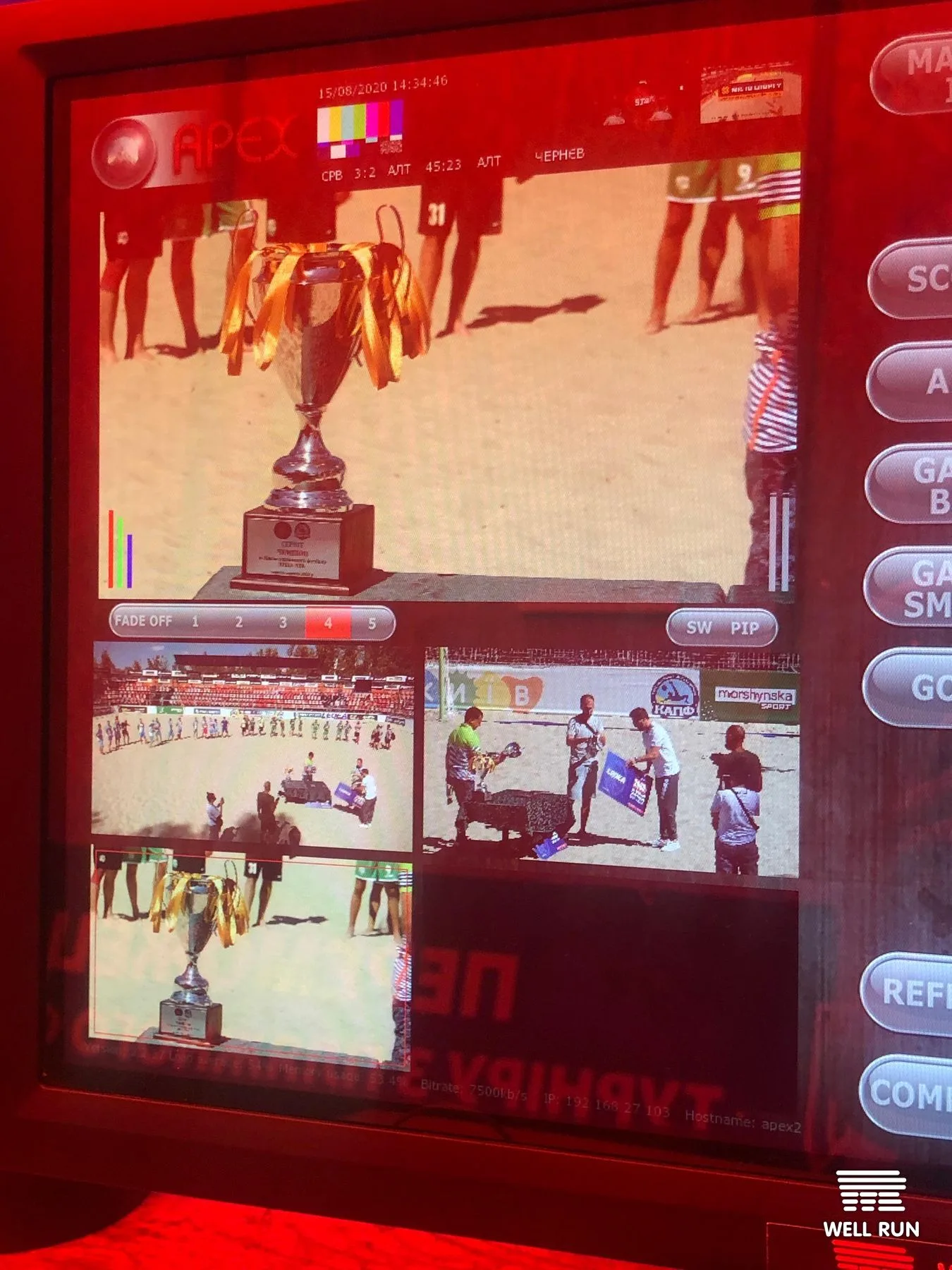 APEX broadcast monitor displaying multi-camera live feed of beach soccer trophy ceremony at Mistosporty Kyiv