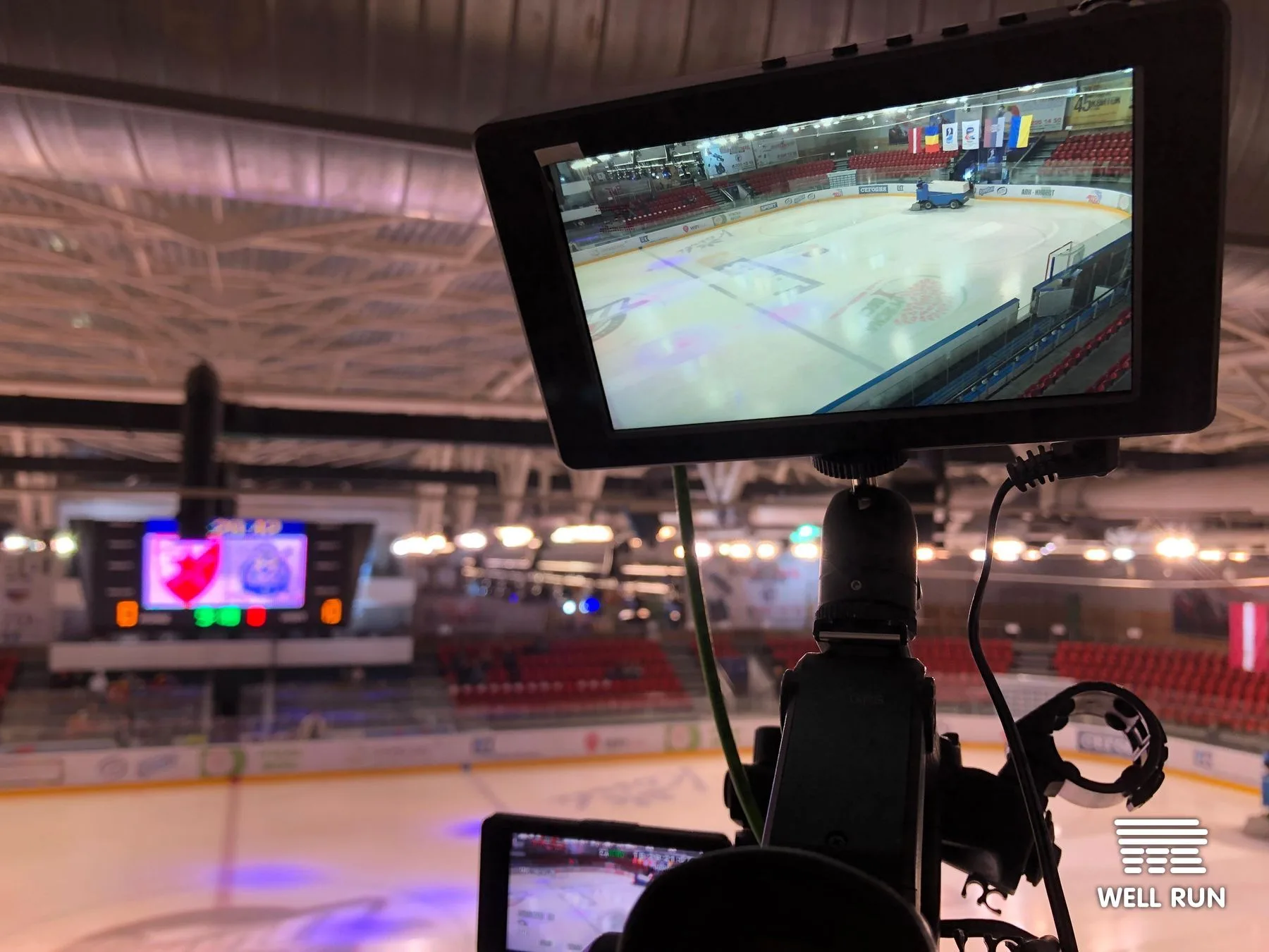 Camera monitor on tripod rig showing Brovary Arena ice surface during IIHF Continental Cup 2019 setup