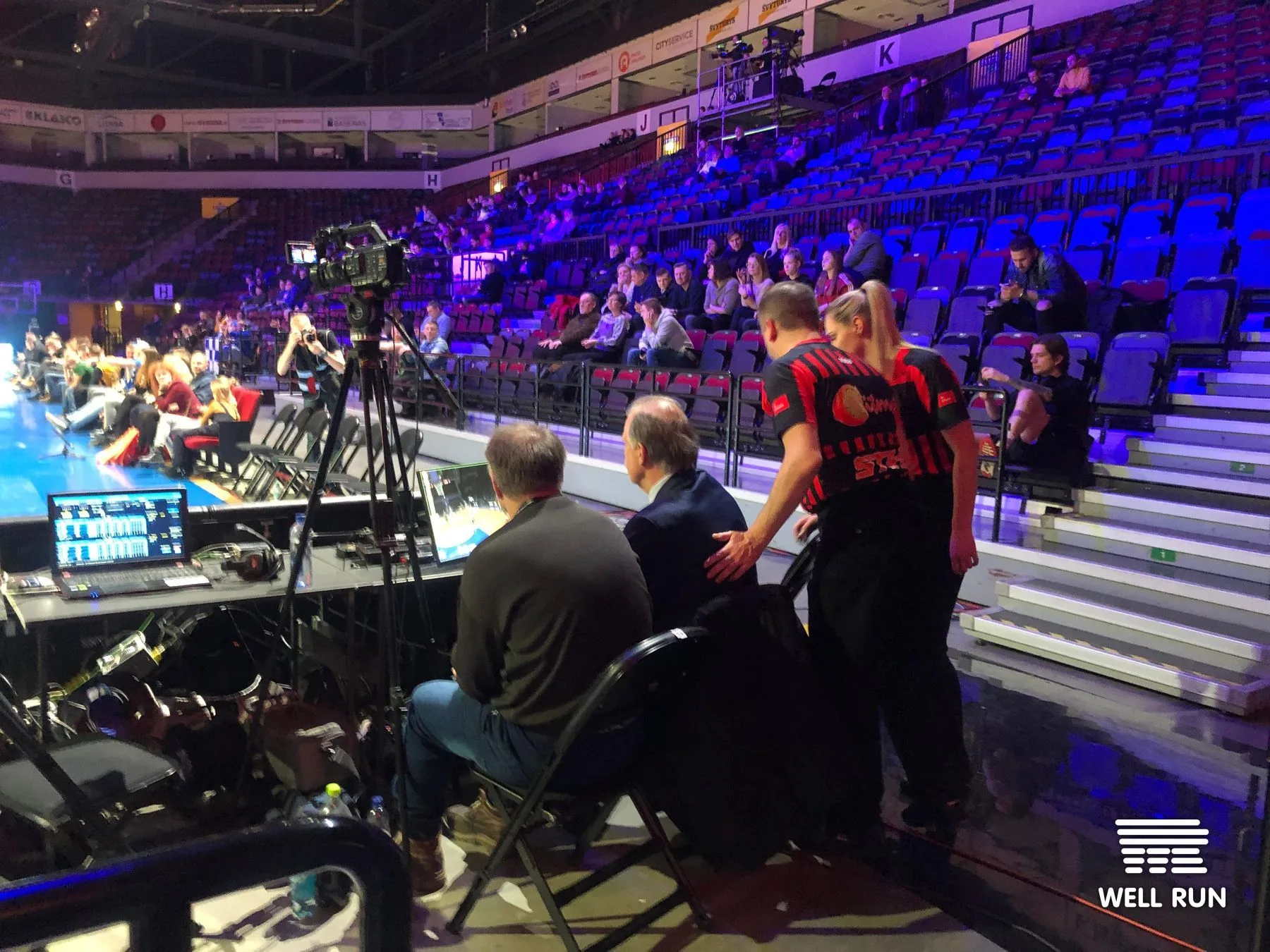 Courtside officials at Švyturys Arena monitor RRM touchscreen review system during basketball Final Four