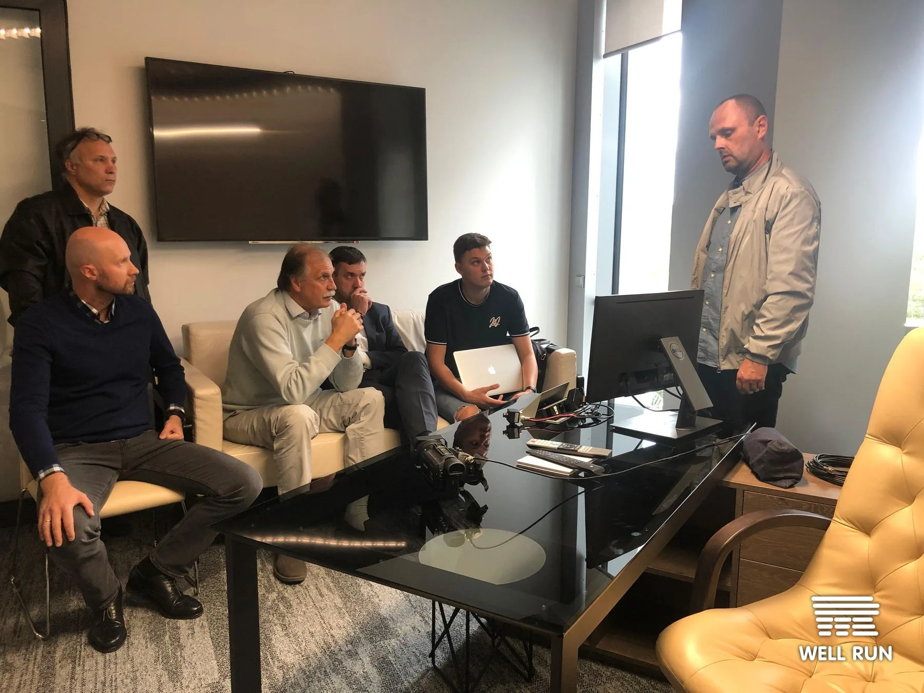 Six men in office review monitor and laptop during LKL RRM basketball video review system demonstration — frame 8