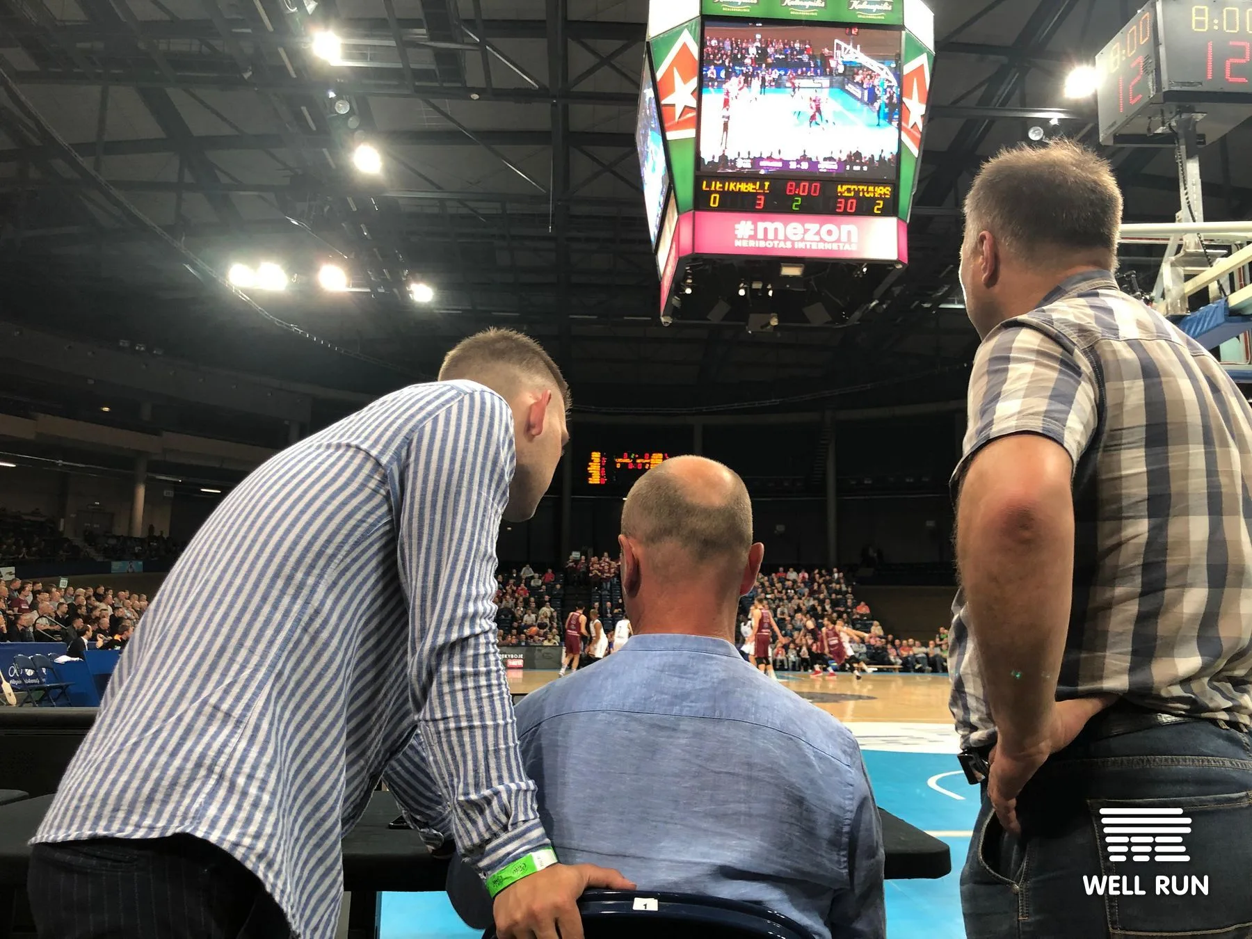 Mykola Moseichenko, Eugenijus Butenis, and Kostiantyn Moseichenko at courtside RRM demo, LKL arena Vilnius