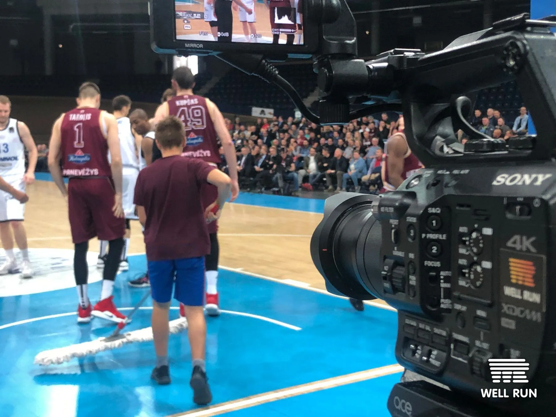 Sony 4K XDCAM camera on court filming LKL basketball players during live game in Vilnius
