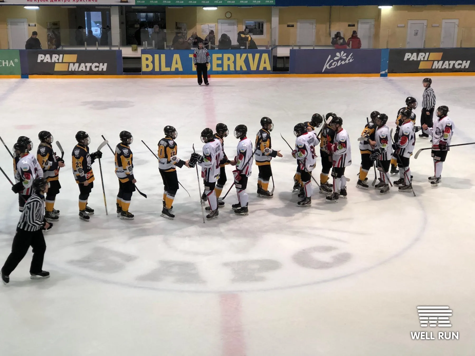 Two ice hockey teams line up for post-game handshake at Ice Arena Bilyi Bars, Bila Tserkva